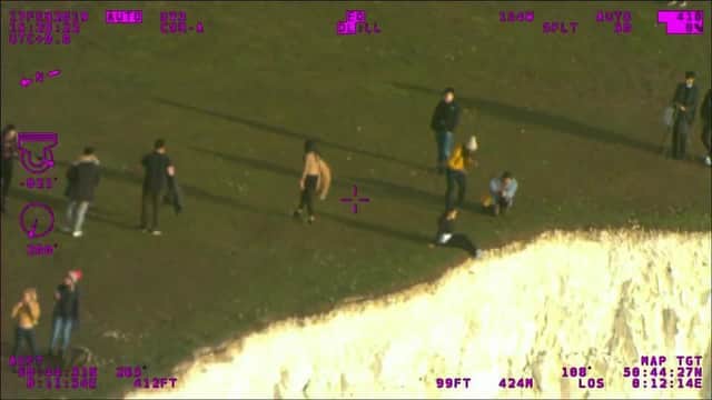 NPAS Redhill shared this shocking photo of young people dangerously close to the cliff edge at Beachy Head