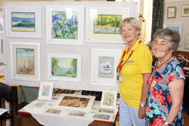 Margaret Bedwell, right, with Valerie Trevor, chairman of Adur Special Needs Project, at the 2018 Shoreham Methodist Church Arts and Crafts Festival. Picture: Derek Martin DM1880054a