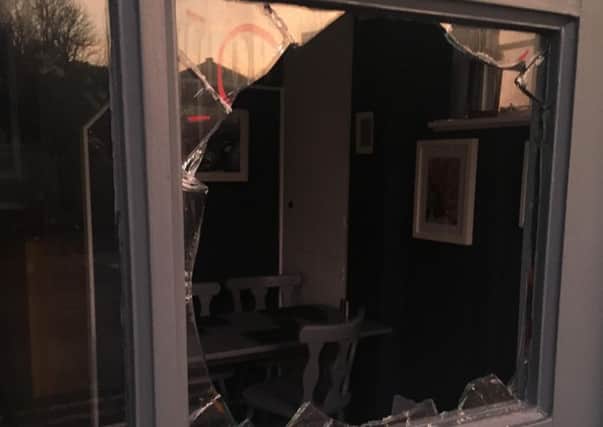 A window was smashed at Nanny Lils café, in Bexhill. Picture: Liza Davidson