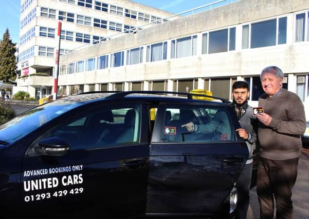 Councillor Geraint Thomas with Mr Ali, a Crawley taxi driver