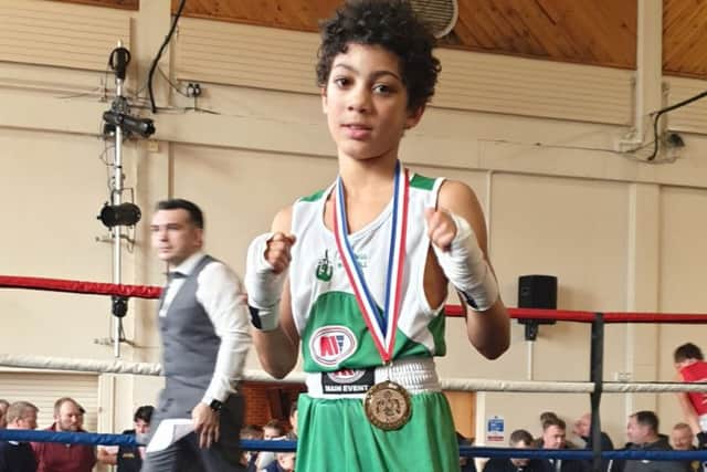 Minkah Okojie celebrates his first victory for West Hill Boxing Club