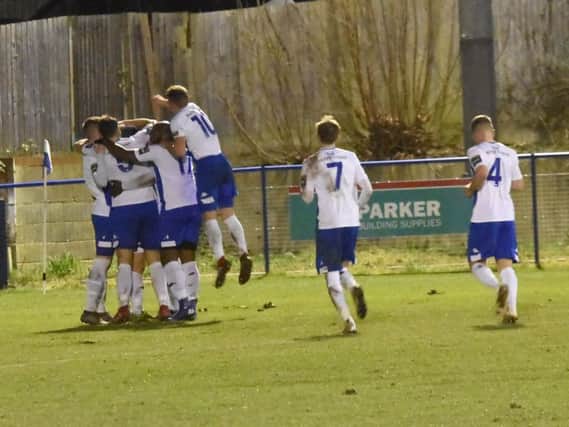 Haywards Heath Town players celebrate during their 2-0 win against Faversham. Picture by Grahame Lehkyj