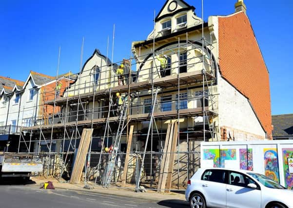 Scaffolding going up around a building In Waterloo Square, Bognor Regis. Pic Steve Robards SR1904343 SUS-190220-125040001