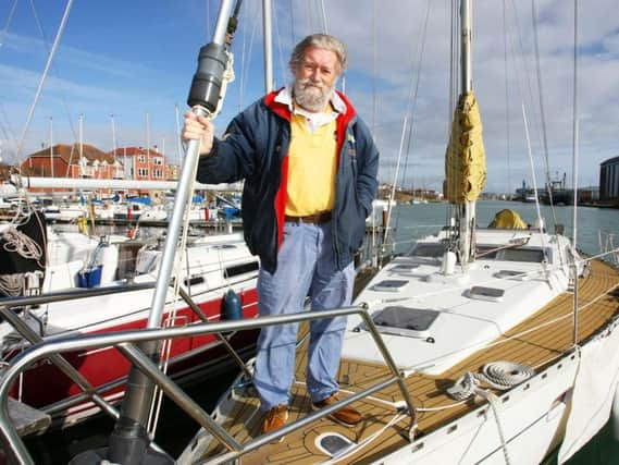 David Skinner at his boat, which is moored in Southwick