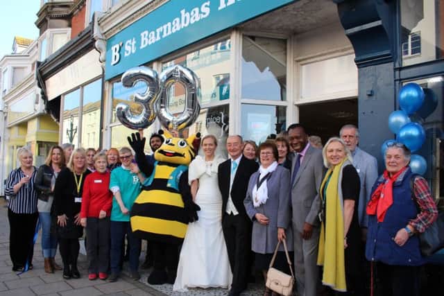 Party guests outside the Worthing St Barnabas House shop