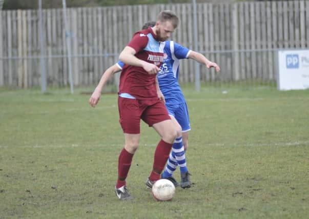 Action from Little Common's home game against Saltdean United earlier this month. Picture by Simon Newstead