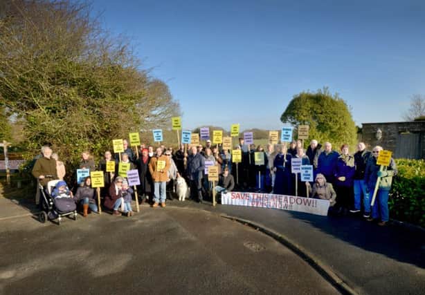 Residents of Clavering Walk, Cooden, protesting over Bellway's plans.

Pictured at the entrance of the proposed site. SUS-190220-103633001