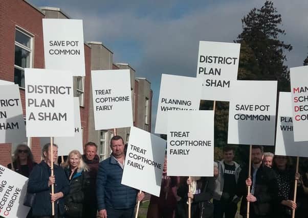 Residents protesting against the application before the committee meeting