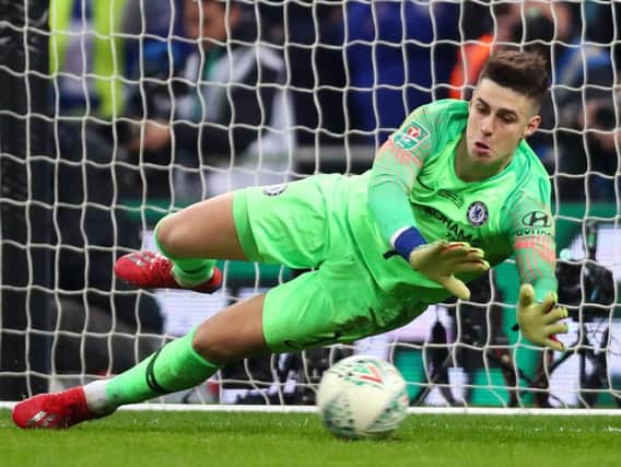 Kepa Arrizabalaga of Chelsea fails to save a penalty from Sergio Aguero of Manchester City in the shoot out during the Carabao Cup Final (Photo by Clive Rose/Getty Images)