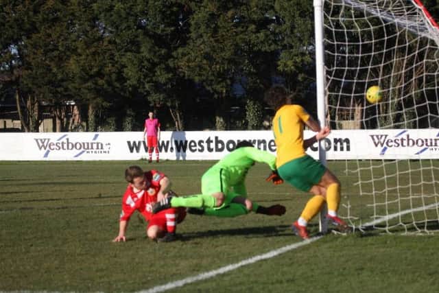 Whitstable v Horsham. Lee Harding collides with the post as he heads in the second goal. Picture by John Lines