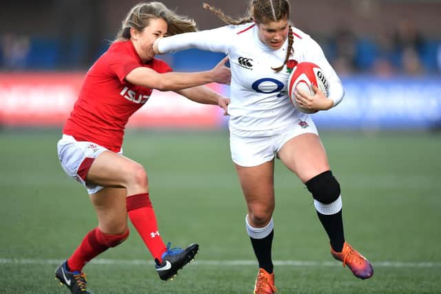 Jess Breach holds off an opponent for England against Wales / Picture: RFU Collection via Getty Images