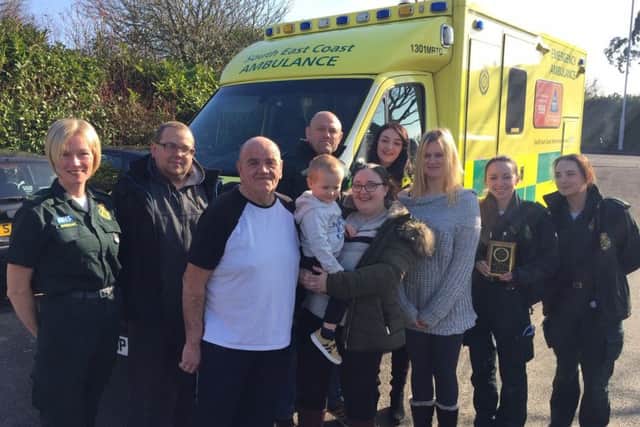 Stephen Massingham presents the plaque to the team at Worthing Ambulance Station to thank them for saving his life