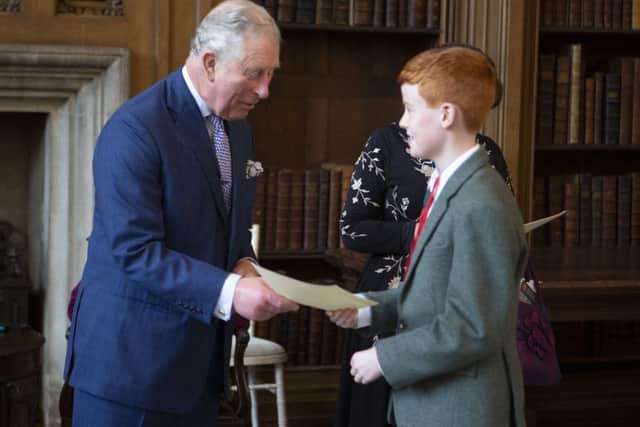 Prince Charles presents certificate to -
Edward Thomson /