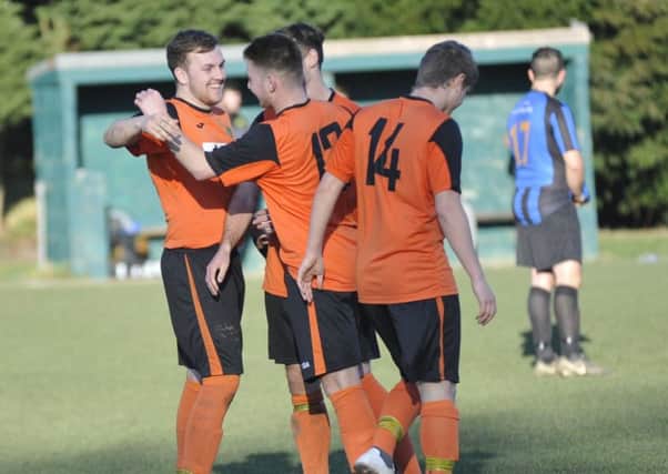 Westfield celebrate their fifth goal in the 5-1 win at home to Worthing Town. Pictures by Simon Newstead