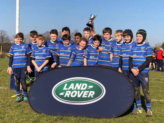 Worthing Rugby Club's under-12 team celebrate with the Land Rover Cup
