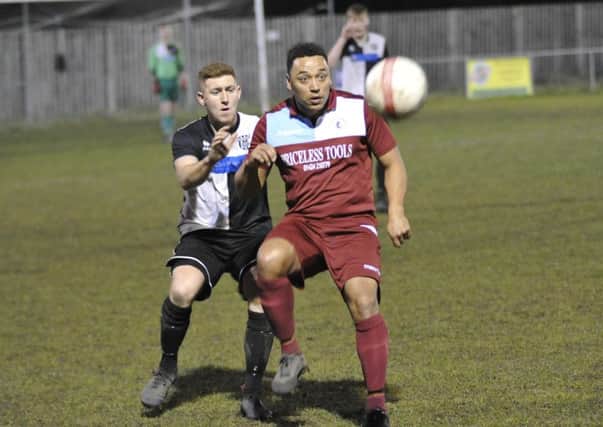 Little Common midfielder Wes Tate lays the ball off during the 1-0 win at home to East Preston. Picture by Simon Newstead