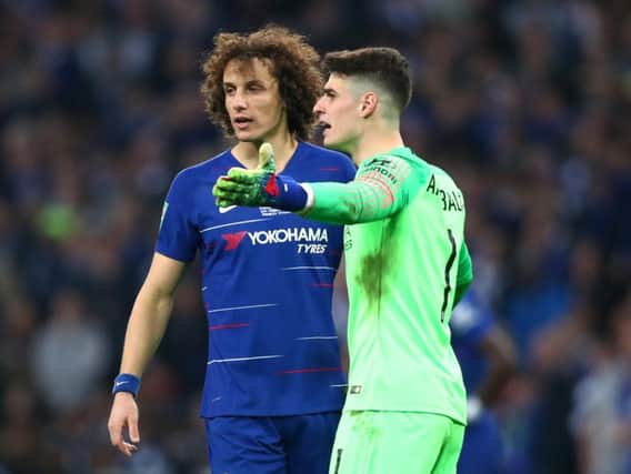 Kepa Arrizabalaga reacts with David Luiz of Chelsea as he refuses to be substituted during the Carabao Cup Final between Chelsea and Manchester City at Wembley Stadium (Photo by Clive Rose/Getty Images)