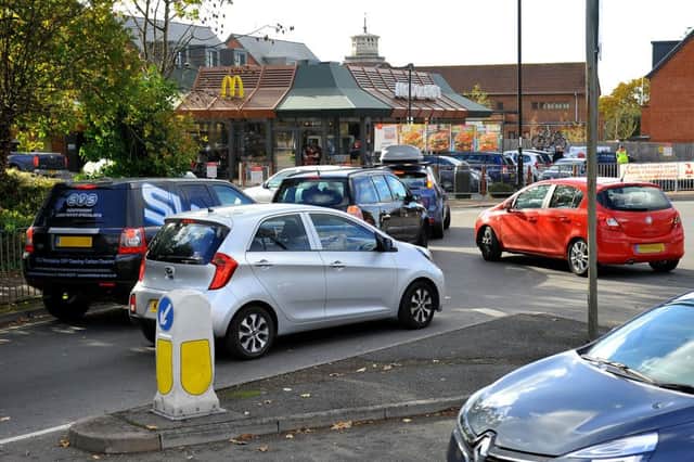 Traffic queueing to enter McDonalds drive thru Burgess Hill is causing problems on the roundabout just outside. Pic Steve Robards SR1829128 SUS-180311-162546001