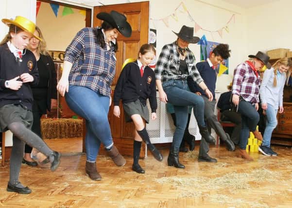 Line-dancing at the American-style hoedown at St Wilfrids Arundel Priory. Photo by Derek Martin DM1924297a