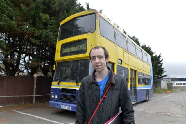 Christopher Bedford with the Big Bus for the homeless (Photo by Jon Rigby)