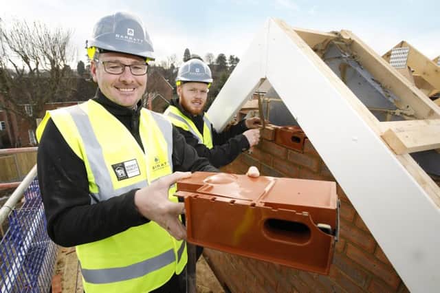Swift Bricks are being installed in new homes in a Barratt development in Hassocks. Pictured is bricklayer apprentice Sam Hoppe and site manager Toby Carson SUS-190227-165549001