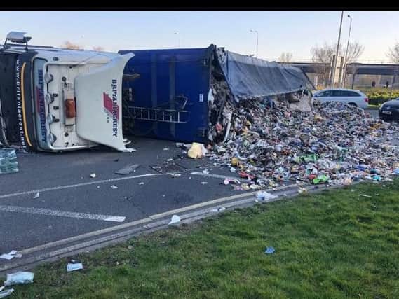 The overturned lorry is causing problems. Picture: Crawley Fire