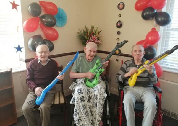 Cavell House residents rocking out at the latest decades event