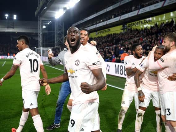 Romelu Lukaku of Manchester United celebrates after his team's third goal scored by Ashley Young of Manchester United (2R) during the Premier League match between Crystal Palace and Manchester United at Selhurst Park. (Photo by Mike Hewitt/Getty Images)