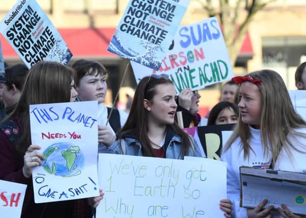 Schoolchildren take part in a nation-wide student climate march on 775299408