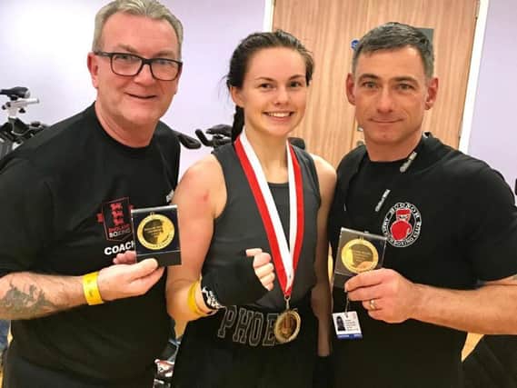 Phoebe Griffiths-Johnson with her Bognor coaches