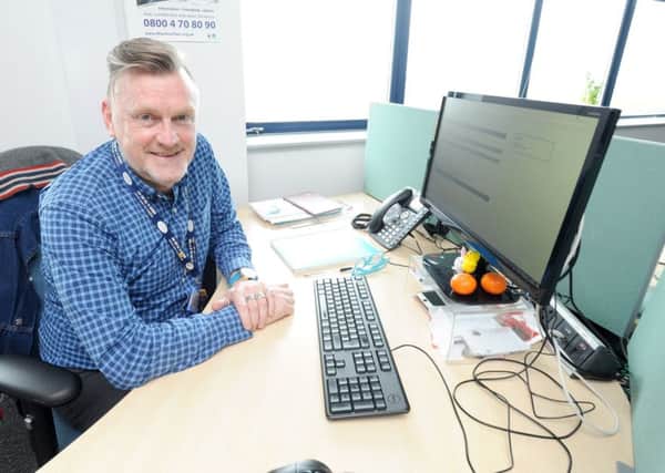 Staff at The Silver Line, a national helpline for older people.  Pictured is volunteer coordinator Kenny Dale. SUS-180523-164312001