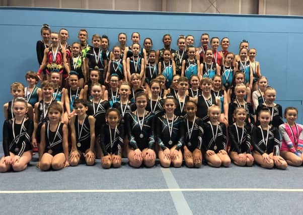 Hollington Gymnastics Club's successful competitors proudly display their medals