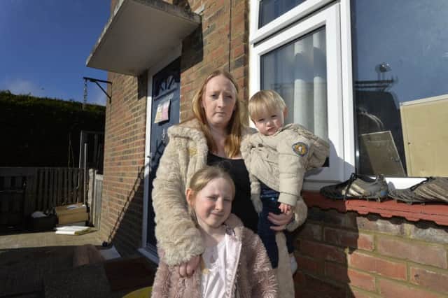 Emma Hall with her children Jackson and Brook outside their home (photo by Jon Rigby)