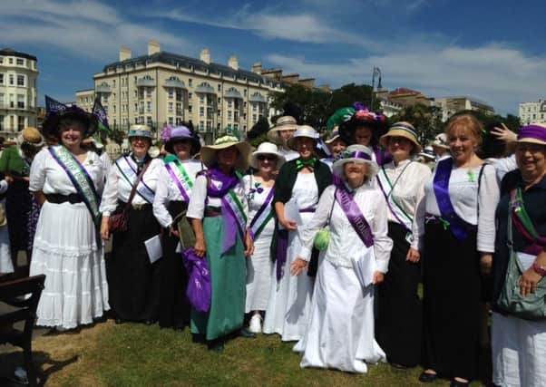 Harmony One choir dressed as suffragettes SUS-180716-091638001