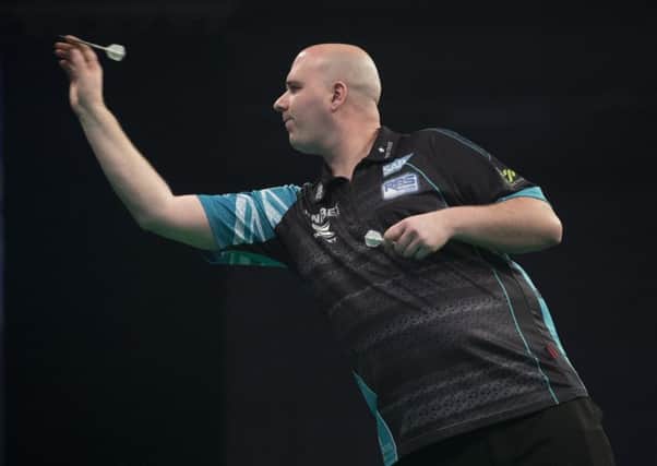 Rob Cross at the oche during his 7-1 win over Daryl Gurney in Exeter tonight. Picture courtesy Lawrence Lustig/PDC