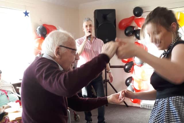 Dancing to music from the 1950s at the themed party
