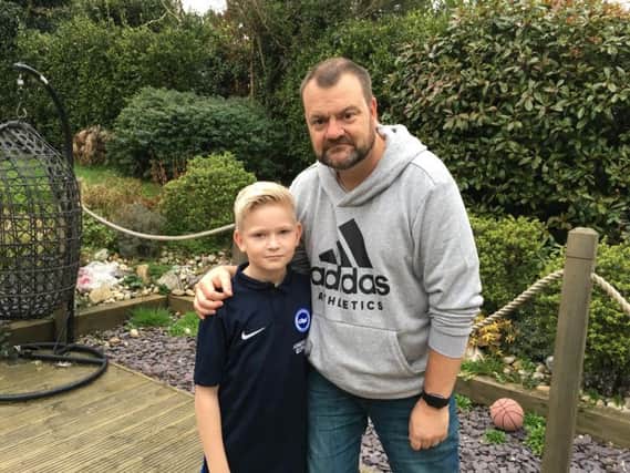 Ian Miller, 50, from Findon, with his son Alfie, 11