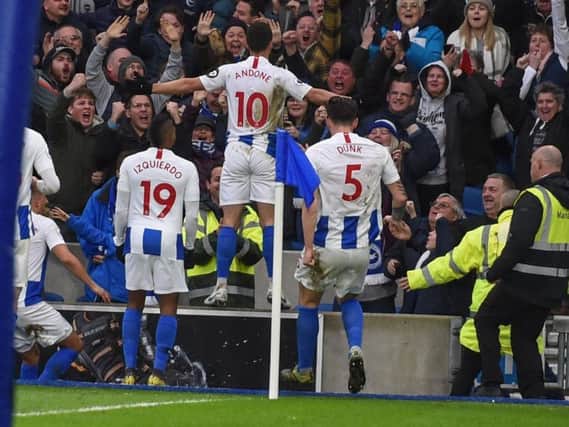 Brighton players and fans celebrate the winning goal against Huddersfield. Picture by PW Sporting Photography