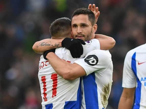 Florin Andone celebrates Brighton's win against Huddersfield with Anthony Knockaert. Picture by PW Sporting Photography
