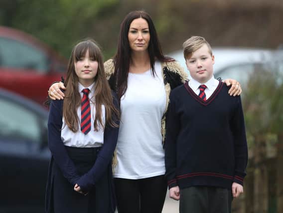 Jacqueline Brook with her children Tiggy (left) and Leon, both 10. Pic: Eddie Mitchell