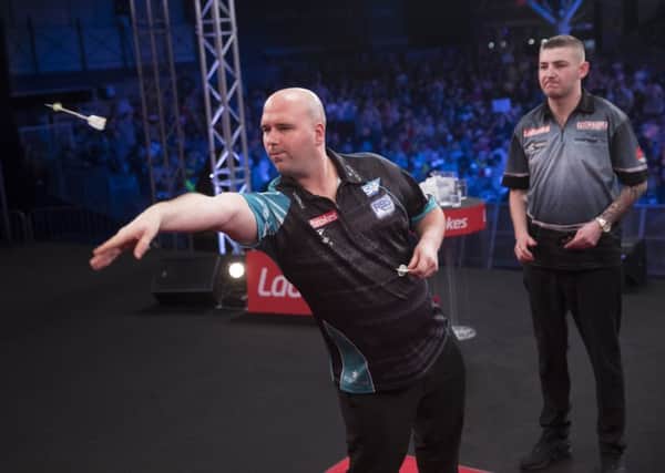 Rob Cross at the oche during the final of the Ladbrokes UK Open against Nathan Aspinall. Picture courtesy Lawrence Lustig/PDC