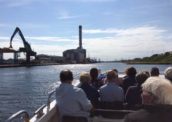Visitors enjoy a boat tour of Shoreham Port