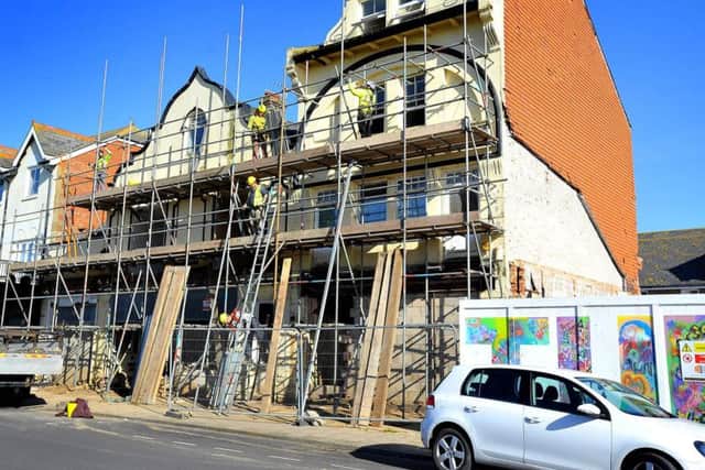 Scaffolding going up around a building In Waterloo Square, Bognor Regis. Pic Steve Robards SR1904343