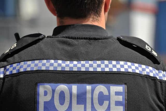A man attacked an elderly woman and stole her shopping trolley in Crawley