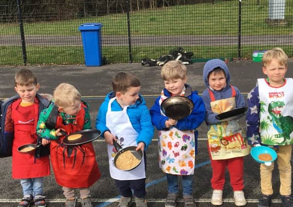 Midhurst Nursery Class children pose with their pancakes