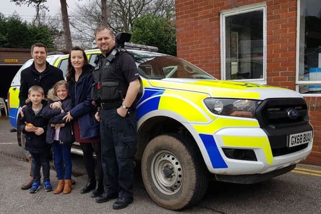 James and his family with Horsham Police officers