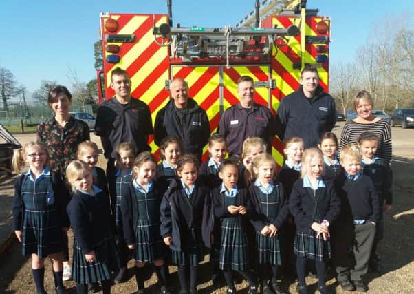 The firefighters join staff and pupils at Farlington