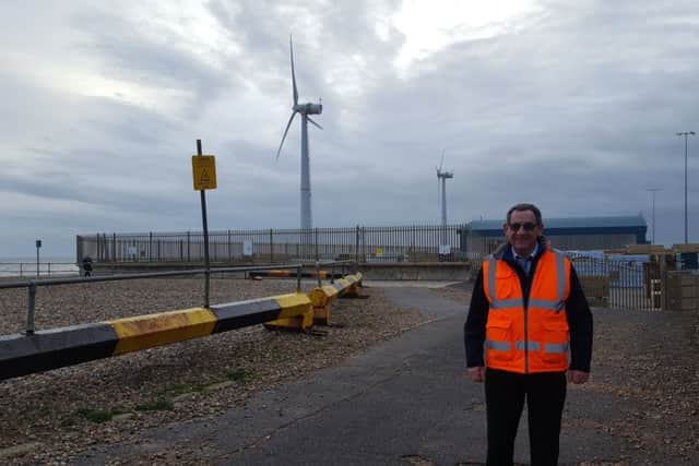 Tony Parker in front of the wind turbines at Shoreham Port SUS-191203-083234001