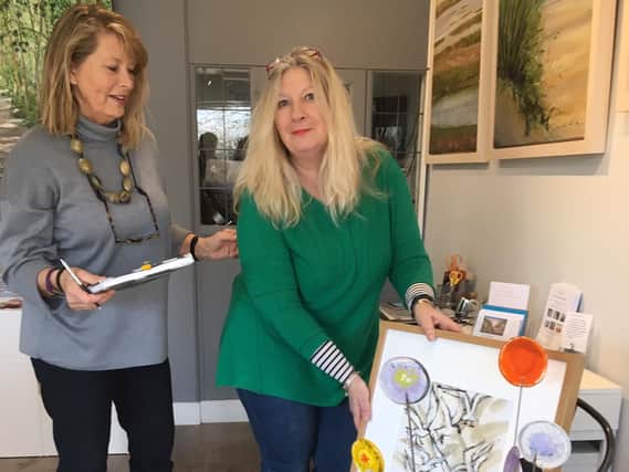 The little art gallery: Karen Ongley-Snook Green delivering artwork to gallery assistant Lisa Kingwell