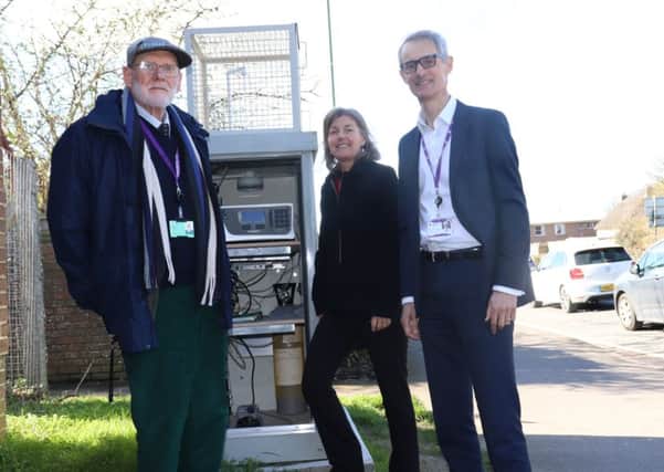 Councillor John Connor, Cabinet Member for the Environment, Kate Simons, Senior Specialist Environmental Health Technician and Simon Ballard, Environmental Protection Manager at the air quality monitoring station on Westhampnett Road.